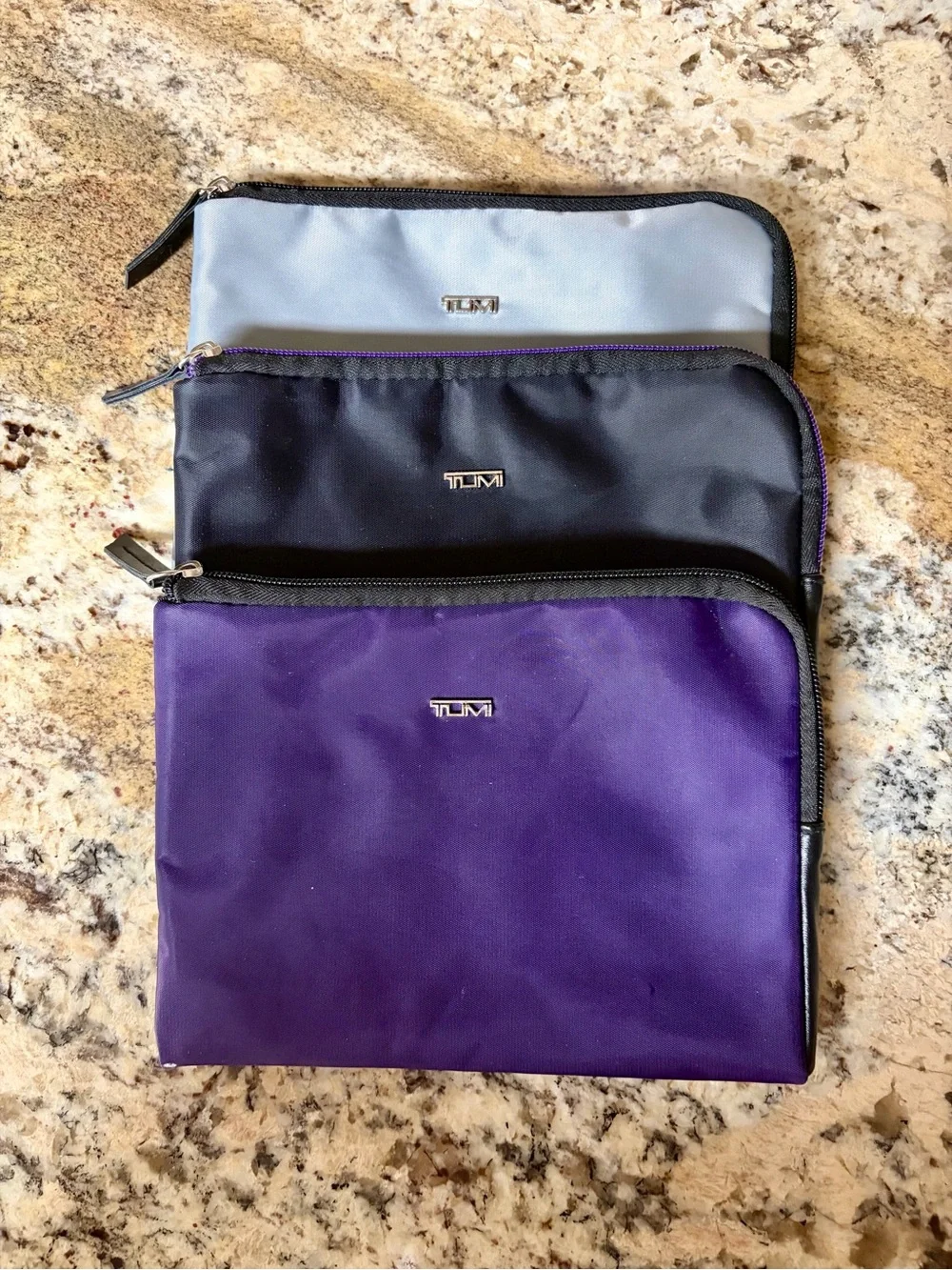 Set of Three TUMI Travel Pouches in Purple, Black & Gray